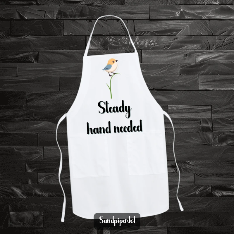 Funny apron featuring a bird shape precariously balancing on a single, thin blade of grass, for a humorous kitchen experience.