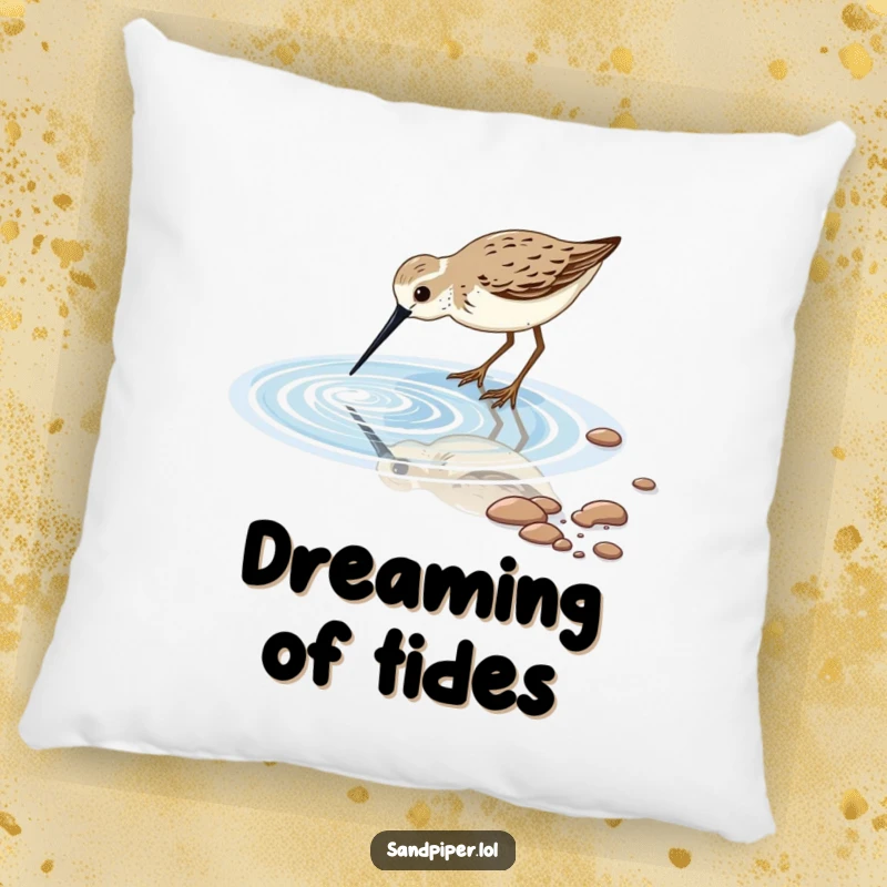 Comfortable pillow featuring a sandpiper bird dipping its beak into a sparkling tidal pool, perfect for serene decor.