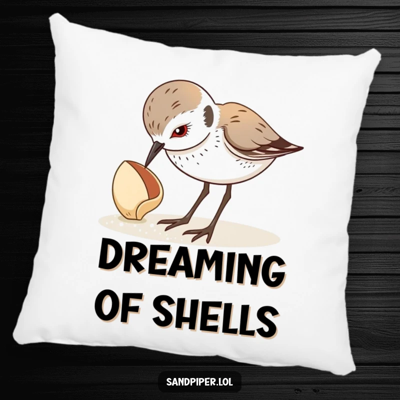 Funny pillow with a sandpiper looking down curiously at a seashell, bringing quiet beach vibes. A delightful funny gift.