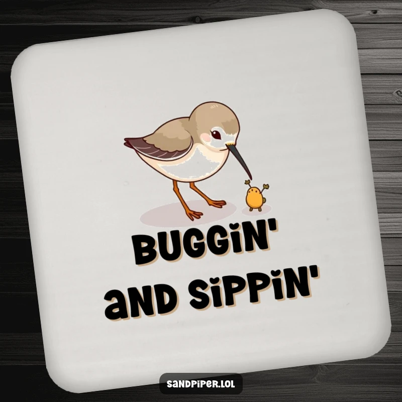 Funny coaster featuring a sandpiper playfully pecking at a tiny imaginary bug, a humorous surface protector. A small funny gift.