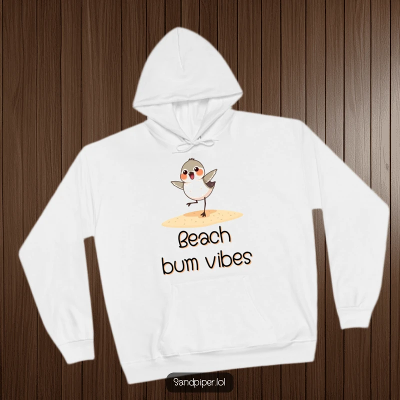 Funny sandpiper hoodie depicting a happy bird spontaneously dancing on a sandy shore, radiating playful energy and comedic charm