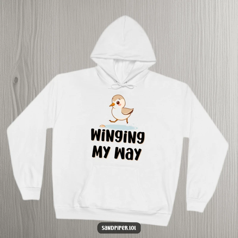Funny hoodie featuring a cute sandpiper happily running along a small shore, symbolizing relaxed beach vibes and cozy comfort.