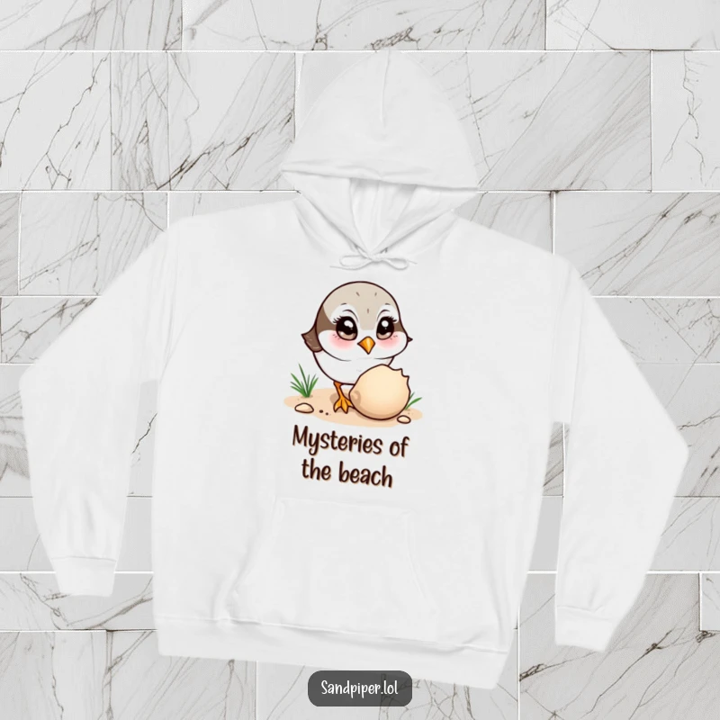 Funny Hoodie: A sandpiper curiously observes a shell, perfect for cozy contemplation and seaside humor.