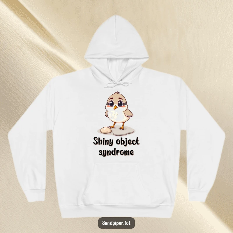 Funny sandpiper hoodie, cozy bird surprised while pecking at a shiny pebble, warm and humorous apparel.