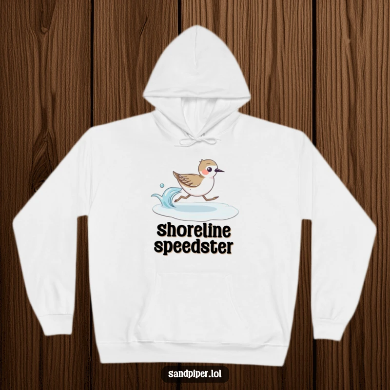 Soft hoodie showcasing a fast-running sandpiper bird with a gentle wave, ideal for coastal comfort and humor.