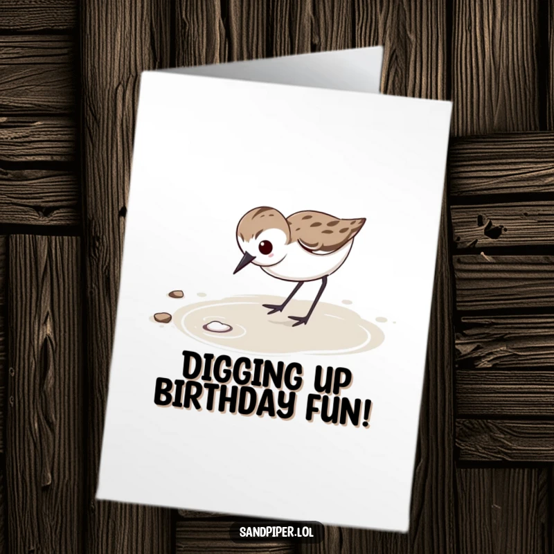 Funny free printable birthday card featuring a determined sandpiper vigorously probing wet sand, bringing focused birthday wishes.