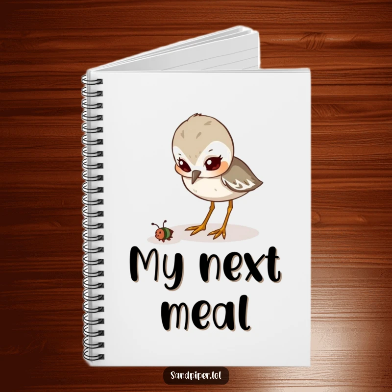 Funny Notebook: A cute sandpiper is depicted with a determined look, pecking at a tiny insect, ideal for focused writing.