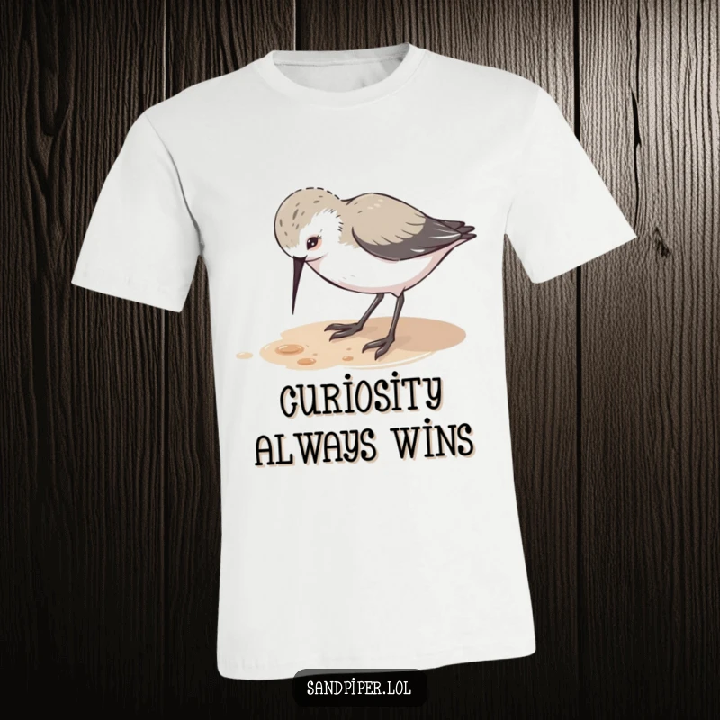 Funny t-shirt featuring a cute sandpiper character pecking at the ground with playful curiosity, embodying a sense of discovery.