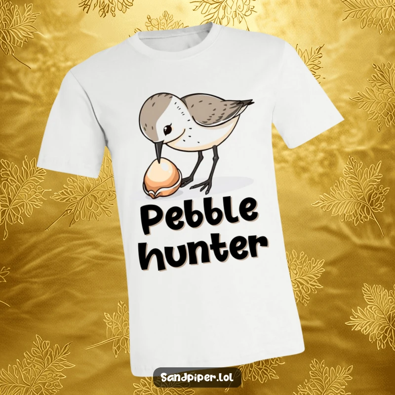 Funny sandpiper bird t-shirt, curiously pecking at a shiny dropped shell, beachy vibes, great funny gift.