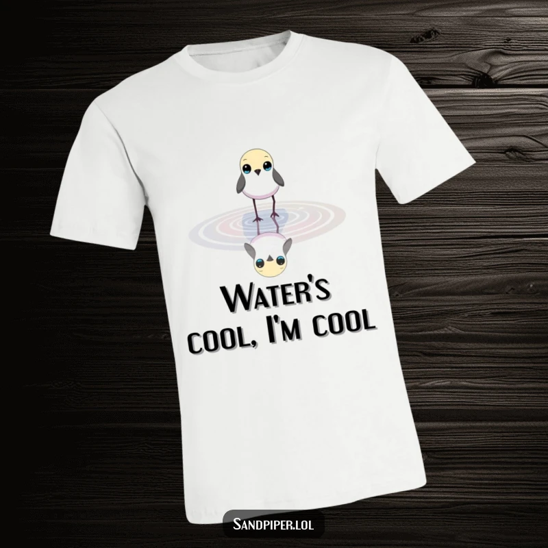 Funny t-shirt featuring a small, slender bird with bright eyes wading gracefully in shallow water, capturing nature's serenity.