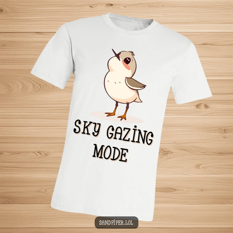 Funny t-shirt featuring a sandpiper bird looking up at the sky with an expression of pure wonder and curiosity.