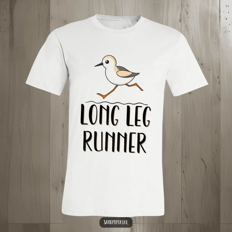 Funny t-shirt with a sandpiper featuring exaggeratedly long legs, running humorously along a wavy line.