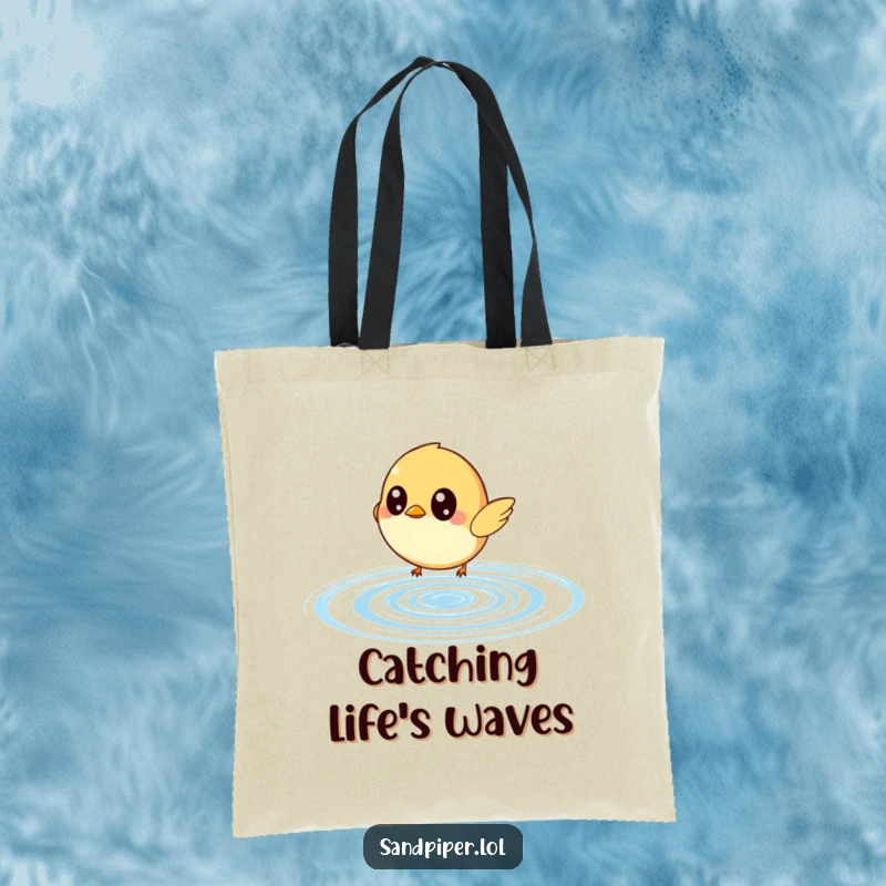 Funny tote bag with a small bird sporting wide eyes, comically chasing a bouncing water ripple; a playful and practical item.