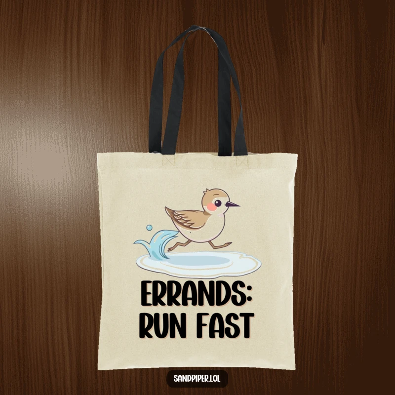 Durable tote bag featuring a speedy sandpiper bird running alongside a gentle wave, perfect for beach trips.